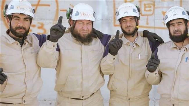 The undated photo shows members of the Western-backed so-called White Helmets "aid" group.
