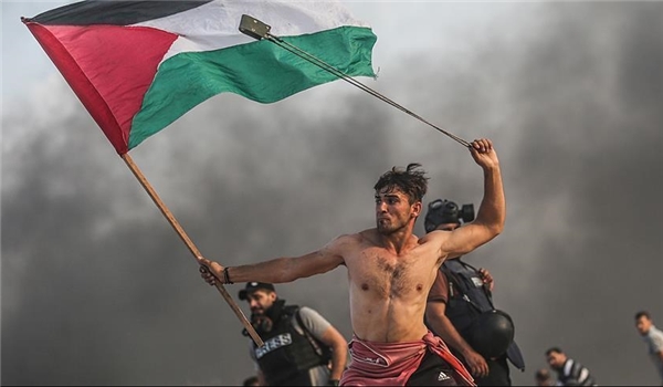 Aid Abu Amr with a Palestinian flag