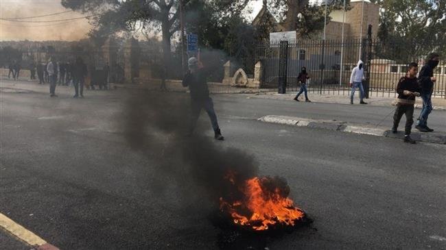 Young Palestinians hurl stones at Israeli military forces in the town of Tuqu’, occupied West Bank, on November 11, 2018. (Photo by the Palestinian Information Center)
