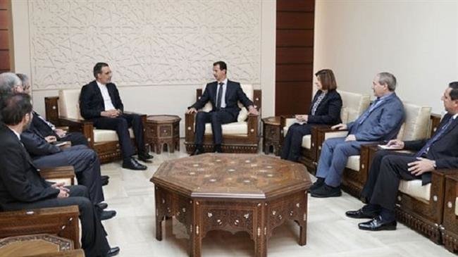 Hossein Jaberi Ansari, senior assistant to the Iranian foreign minister on special political affairs, (C-L) meets with Syrian President Bashar al-Assad (C-R) in Damascus on November 12, 2018. (Photo by SANA)

