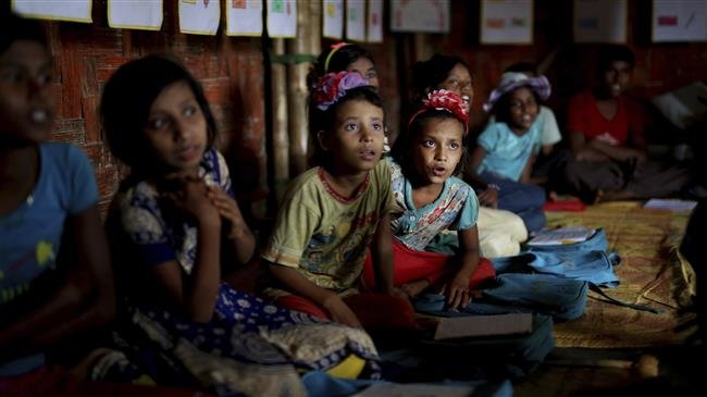 Rohingya refugee children attend a UNICEF-run school in the Balukhali refugee camp, in Bangladesh, on August 27, 2018. (Photo by AP)
