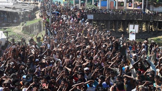 Rohingya refugees shout slogans at a protest against a disputed repatriation program at the Unchiprang refugee camp, near Teknaf, in Bangladesh, on November 15, 2018. (Photo by AFP)
