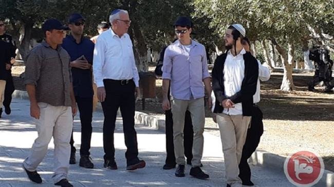 Israeli minister of agriculture and rural development, Uri Ariel, center, clad in white, is seen along with other Israeli settlers as they enter the al-Aqsa Mosque compound, on November 18, 2018. (Photo by Ma’an)

