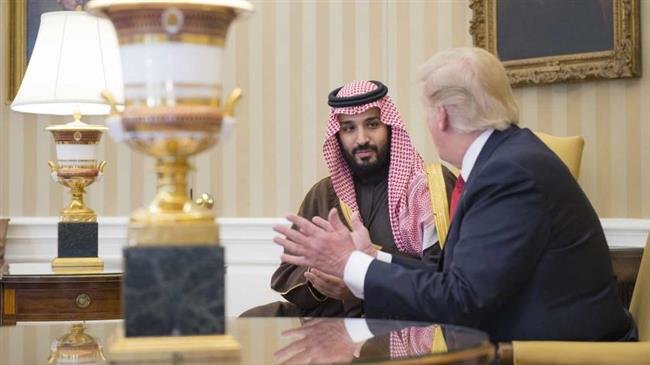 Saudi Crown Prince Mohammed bin Salman listens to US President Donald Trump during a meeting in Washington, March 20, 2018.

