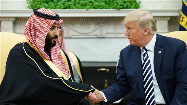 In this file photo taken on March 20, 2018, US President Donald Trump (R) shakes hands with Saudi Arabia