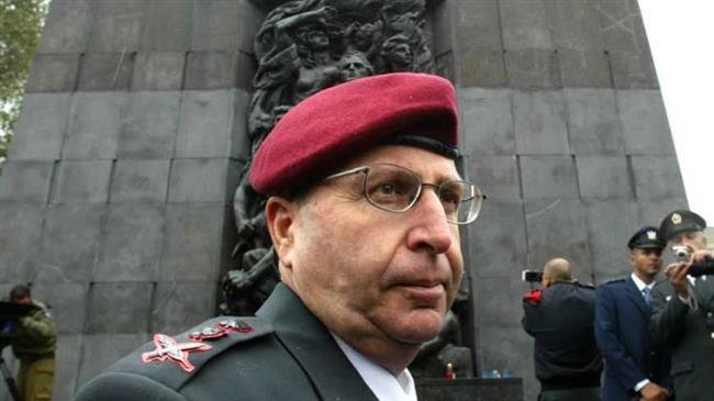 Moshe Ya’alon, former chief of staff of the Israeli army, stands in front of the Warsaw Ghetto monument in Poland on May 18, 2005. (Photo by Reuters)
