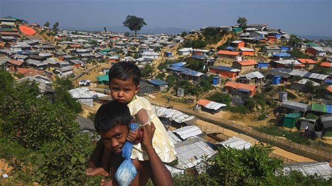 Young Rohingya refugees look on as a general view of Balukhali refugee camp is pictured in Ukhia, Bangladesh, on November 16, 2018. (Photo by AFP)
