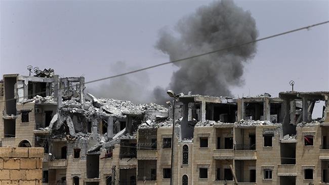 This file photo shows the aftermath of a US-led coalition airstrike against a purported Daesh militant position in the northern Syrian city of Raqqah. (Photo by the Associated Press)