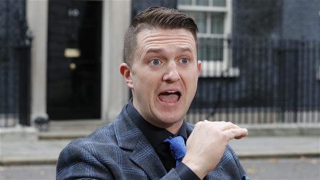 This November 6, 2018 file photo shows top UK Islamophobe Tommy Robinson talks to the media after delivering a petition to 10 Downing Street in central London. (AFP photo)
