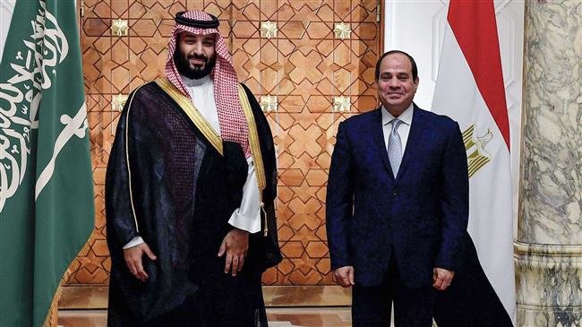 A handout picture released by the Egyptian Presidency on November 27, 2018 shows Egyptian President Abdel Fattah el-Sisi (R) meeting with Saudi Crown Prince Mohammed bin Salman at the presidential palace in the Egyptian capital Cairo. (Photo by AFP)
