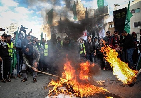 Palestinian Protesters Burn Israeli Flags during A Demonstration against US Plane