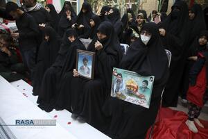 مراسم تدفین پیکر پاک شهید گمنام دفاع مقدس در مدرسه علمیه خواهران حضرت آمنه